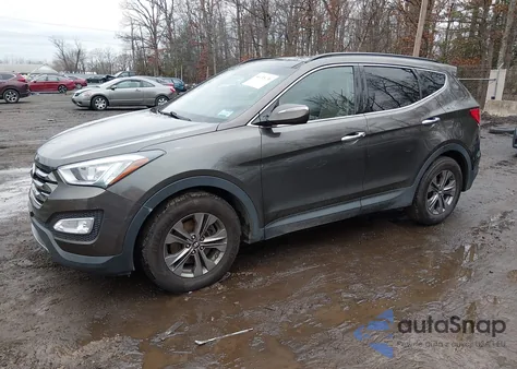 2014 Hyundai Santa Fe Sport 2.4L z USA, uszkodzony, nr VIN 5XYZUDLB1EG206574
